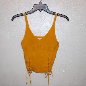 Papaya Small crop top. Very cute, has string on the side you can tie and adjust.